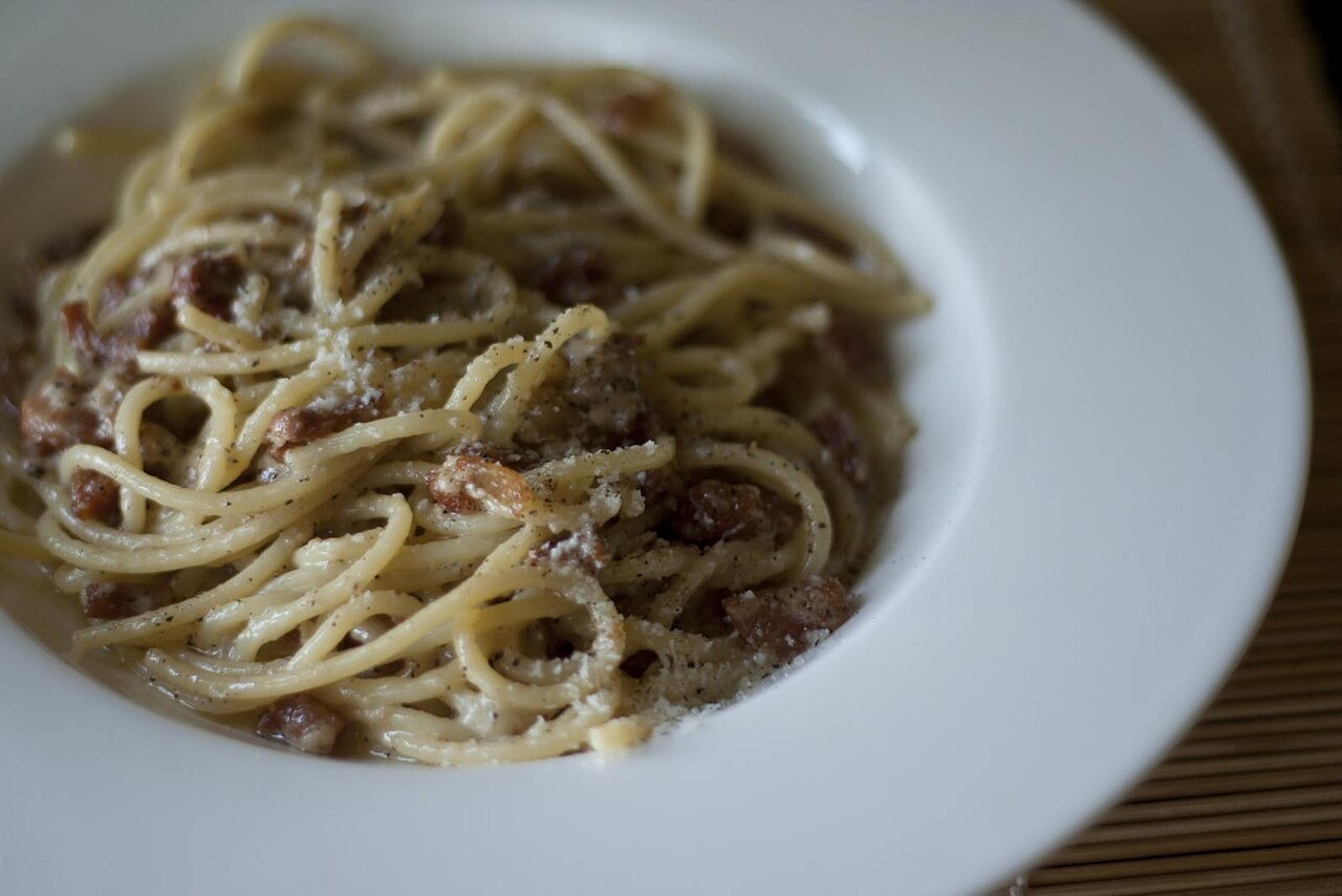 Pasta alla gricia — spaghetti with guanciale, Pecorino Romano and black pepper, the guanciale-and-Pecorino base of Rome's four classic pastas