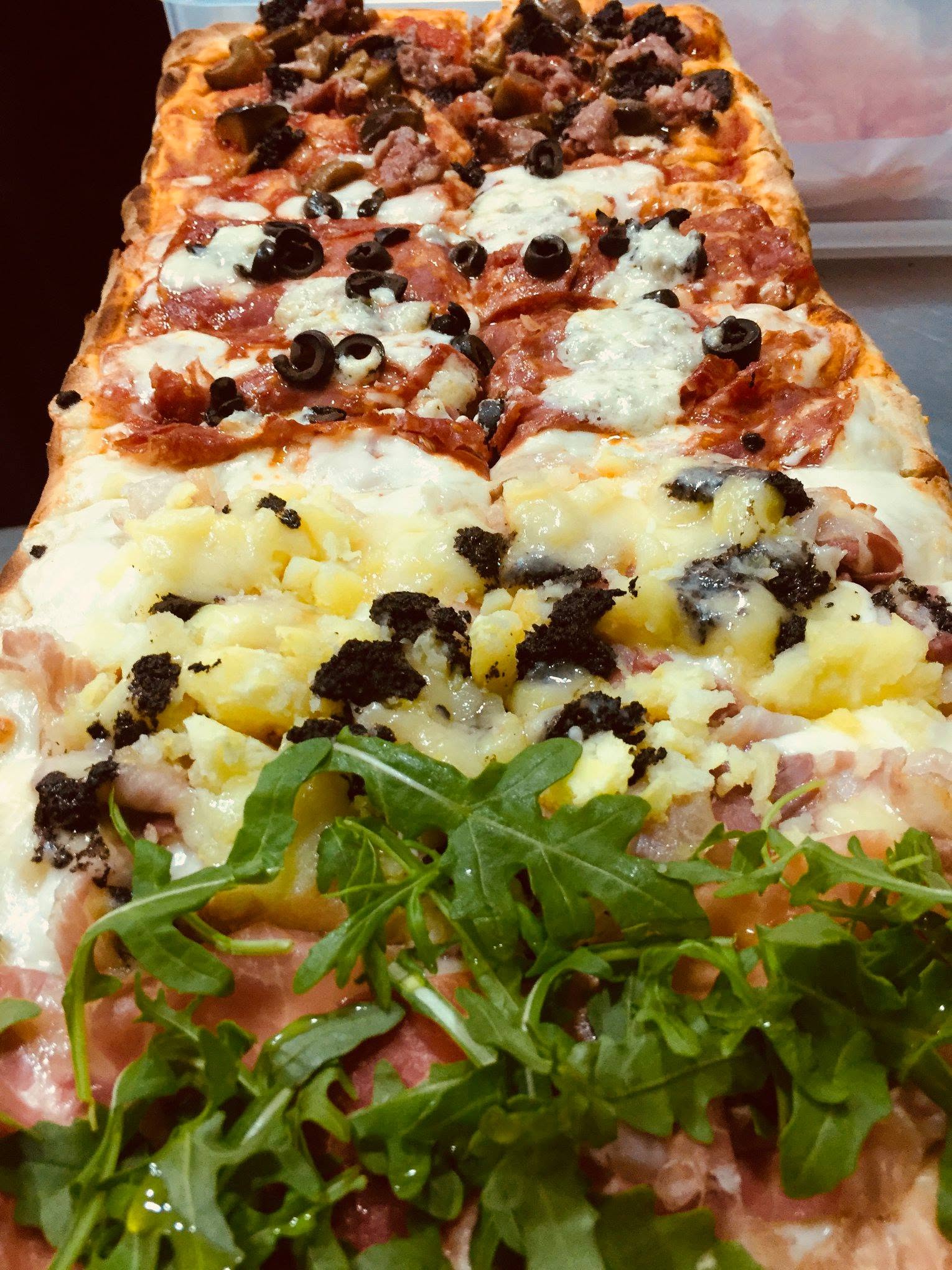 A metre of Roman pizza with cured meats, cheeses and rocket at Sora Lella, Lisbon